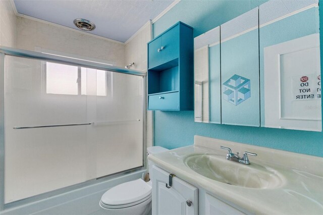 638 La Jolla Ave, Sun City Center, FL 33573 - bathroom with vanity and bath / shower combo with glass door