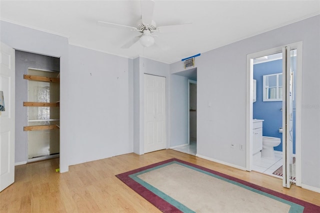 638 La Jolla Ave, Sun City Center, FL 33573 - unfurnished bedroom featuring wood finished floors, ornamental molding, and ensuite bath