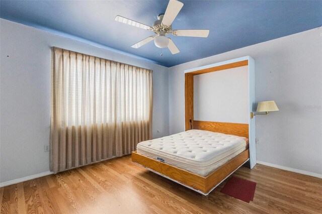 638 La Jolla Ave, Sun City Center, FL 33573 - bedroom with wood finished floors and ceiling fan