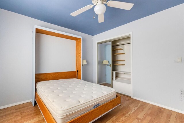 638 La Jolla Ave, Sun City Center, FL 33573 - bedroom featuring wood finished floors, a closet, and a ceiling fan