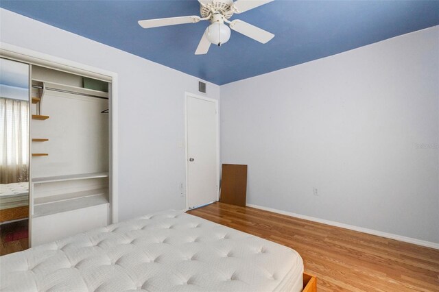 638 La Jolla Ave, Sun City Center, FL 33573 - bedroom featuring wood finished floors, a closet, and a ceiling fan