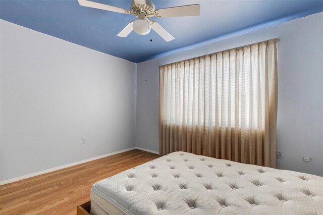 638 La Jolla Ave, Sun City Center, FL 33573 - bedroom with wood finished floors and a ceiling fan