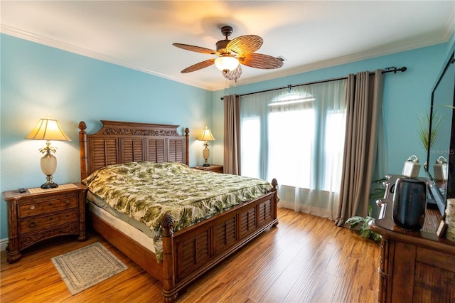 2724 Via Murano Unit 639, Clearwater, FL 33764 - bedroom with wood finished floors, crown molding, and ceiling fan