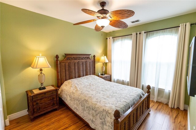 2724 Via Murano Unit 639, Clearwater, FL 33764 - bedroom featuring wood finished floors and a ceiling fan