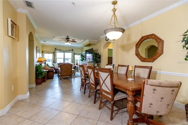 2724 Via Murano Unit 639, Clearwater, FL 33764 - dining space featuring arched walkways, ceiling fan, crown molding, and light tile patterned floors