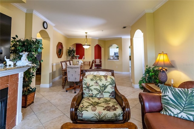 2724 Via Murano Unit 639, Clearwater, FL 33764 - living area featuring arched walkways, ornamental molding, and light tile patterned floors