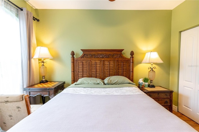 2724 Via Murano Unit 639, Clearwater, FL 33764 - bedroom featuring wood finished floors and baseboards