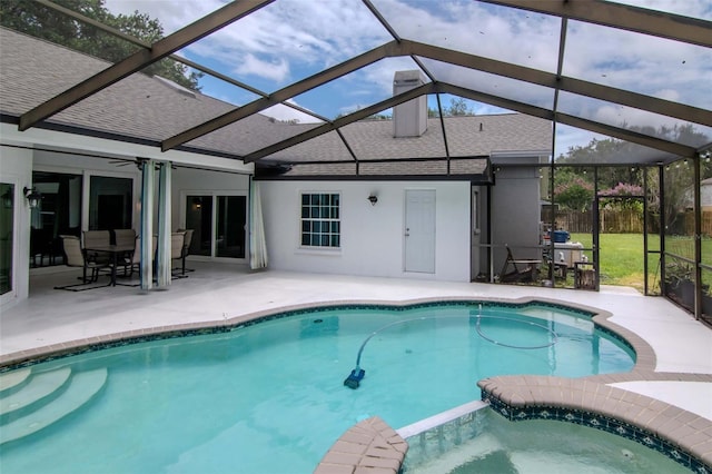 18004 Clear Lake Dr, Lutz, FL 33548 - view of swimming pool with a patio area, glass enclosure, and a pool with connected hot tub
