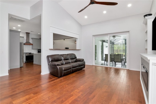 18004 Clear Lake Dr, Lutz, FL 33548 - living room featuring a ceiling fan, dark wood-style floors, lofted ceiling, and recessed lighting