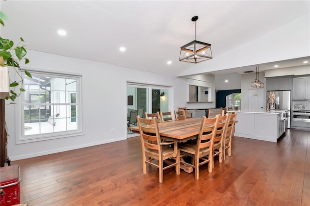 18004 Clear Lake Dr, Lutz, FL 33548 - dining room with dark wood-type flooring, recessed lighting, and lofted ceiling