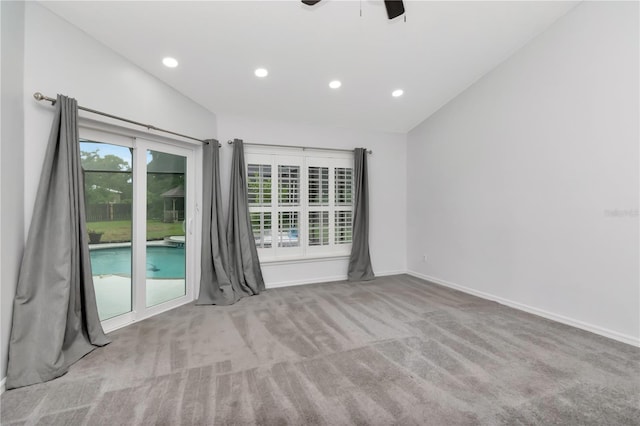 18004 Clear Lake Dr, Lutz, FL 33548 - unfurnished room featuring vaulted ceiling, carpet floors, recessed lighting, and ceiling fan