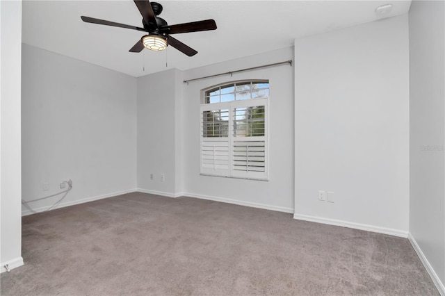 18004 Clear Lake Dr, Lutz, FL 33548 - unfurnished room featuring carpet flooring, ceiling fan, and a smoke detector