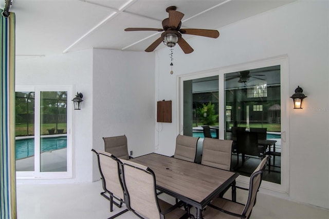 18004 Clear Lake Dr, Lutz, FL 33548 - view of patio with outdoor dining space, ceiling fan, and an outdoor pool
