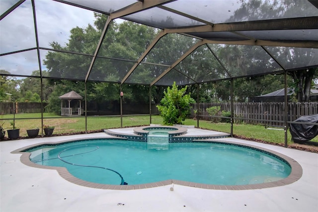 18004 Clear Lake Dr, Lutz, FL 33548 - view of swimming pool featuring a fenced backyard, glass enclosure, a gazebo, and a pool with connected hot tub