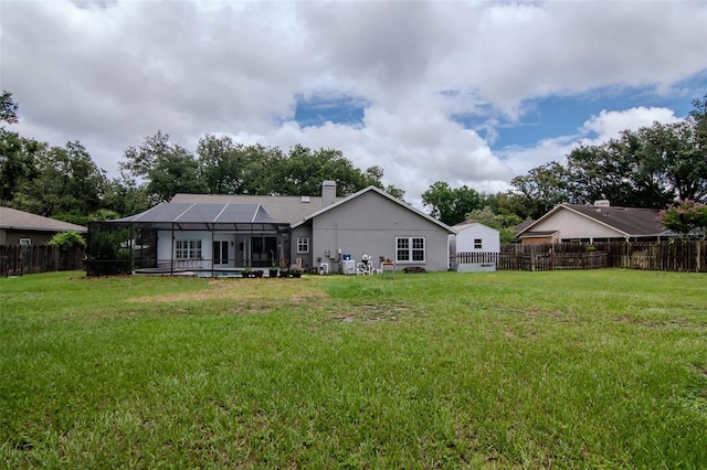18004 Clear Lake Dr, Lutz, FL 33548 - back of property featuring glass enclosure and a chimney