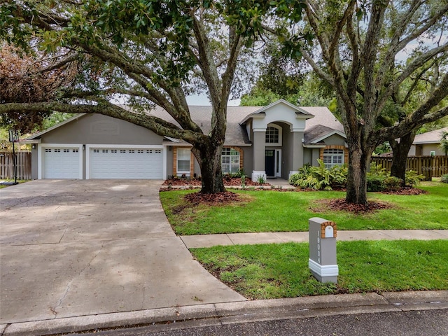 18004 Clear Lake Dr, Lutz, FL 33548 - ranch-style house featuring stucco siding, concrete driveway, a shingled roof, and a garage