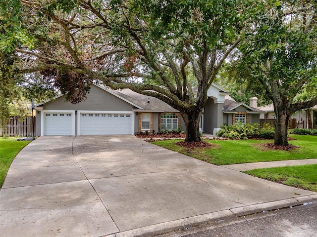 18004 Clear Lake Dr, Lutz, FL 33548 - single story home featuring concrete driveway, stucco siding, and an attached garage