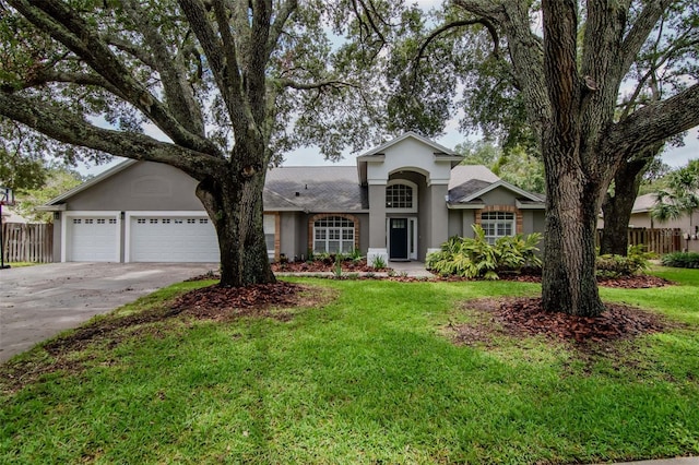 18004 Clear Lake Dr, Lutz, FL 33548 - single story home featuring stucco siding, concrete driveway, and an attached garage