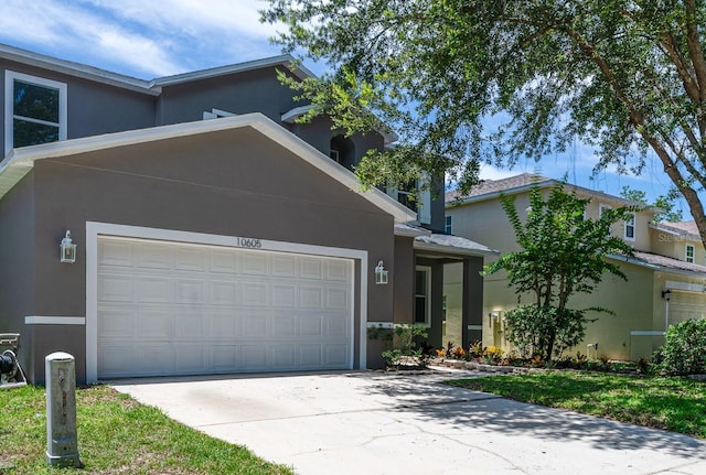 10605 Marsanne Pl, Riverview, FL 33578 - view of front facade featuring stucco siding, driveway, and an attached garage