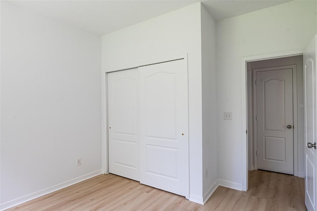 10605 Marsanne Pl, Riverview, FL 33578 - unfurnished bedroom featuring light wood-type flooring and a closet