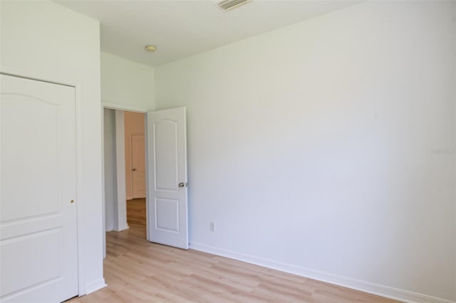 10605 Marsanne Pl, Riverview, FL 33578 - unfurnished bedroom with light wood-style flooring and a closet