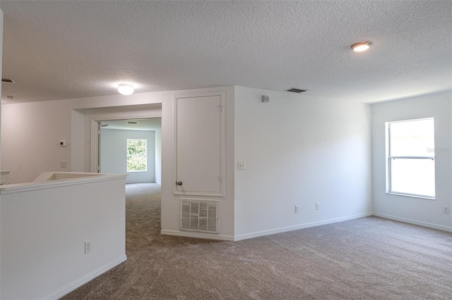 10605 Marsanne Pl, Riverview, FL 33578 - carpeted empty room with a textured ceiling and baseboards