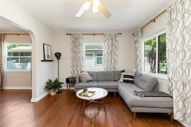 2834 10th Ave N, Saint Petersburg, FL 33713 - living area with wood finished floors, plenty of natural light, a ceiling fan, and arched walkways