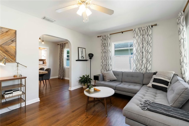 2834 10th Ave N, Saint Petersburg, FL 33713 - living area with arched walkways, ceiling fan, and wood finished floors