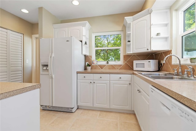 2834 10th Ave N, Saint Petersburg, FL 33713 - kitchen featuring white appliances, open shelves, white cabinetry, tasteful backsplash, and recessed lighting