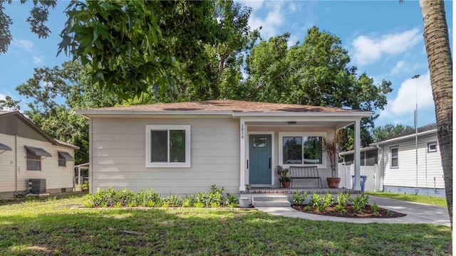 2834 10th Ave N, Saint Petersburg, FL 33713 - view of front facade featuring a porch and a front yard