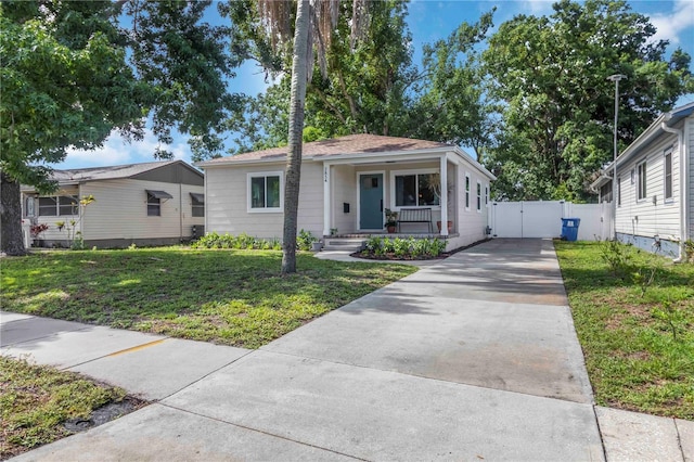 2834 10th Ave N, Saint Petersburg, FL 33713 - view of front of property featuring a gate, concrete driveway, and covered porch