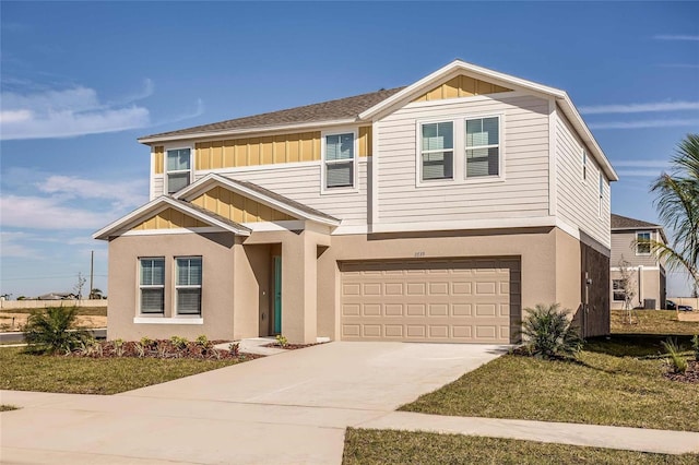 14819 Summer Branch Dr, Lithia, FL 33547 - view of front facade with board and batten siding, driveway, a garage, and stucco siding
