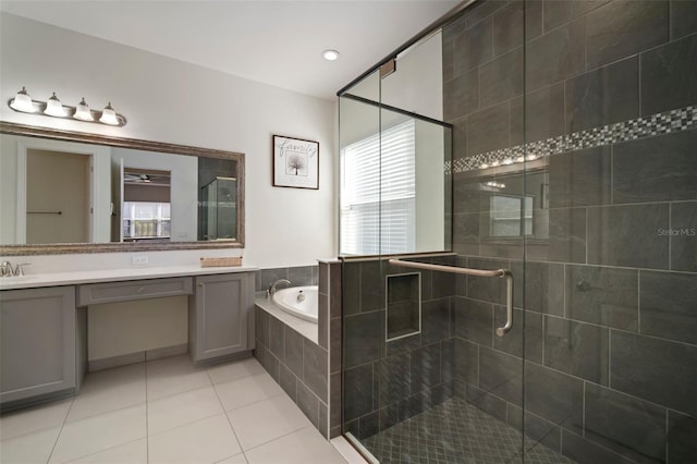 3326 Acacia Bay Ave, Wesley Chapel, FL 33543 - bathroom featuring a bath, a stall shower, double vanity, and tile patterned floors