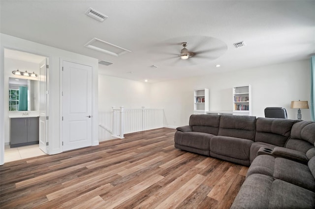 3326 Acacia Bay Ave, Wesley Chapel, FL 33543 - living room featuring attic access, light wood finished floors, ceiling fan, and recessed lighting