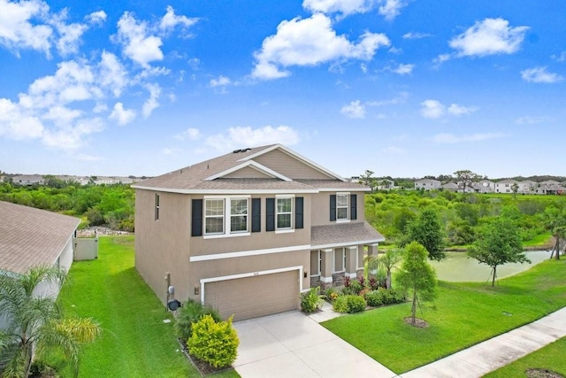 5430 Thistle Field Ct, Wesley Chapel, FL 33545 - view of front of property featuring stucco siding, concrete driveway, a shingled roof, a front lawn, and a garage
