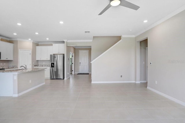 5430 Thistle Field Ct, Wesley Chapel, FL 33545 - kitchen with stainless steel fridge, ornamental molding, white cabinetry, recessed lighting, and a ceiling fan