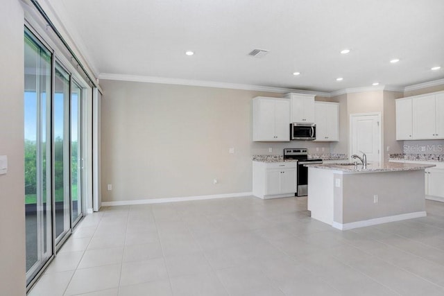 5430 Thistle Field Ct, Wesley Chapel, FL 33545 - kitchen featuring stainless steel appliances, healthy amount of natural light, crown molding, recessed lighting, and a center island with sink