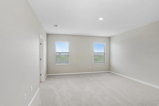 5430 Thistle Field Ct, Wesley Chapel, FL 33545 - spare room with light carpet and recessed lighting
