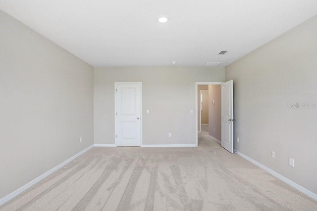 5430 Thistle Field Ct, Wesley Chapel, FL 33545 - unfurnished bedroom featuring baseboards and light colored carpet