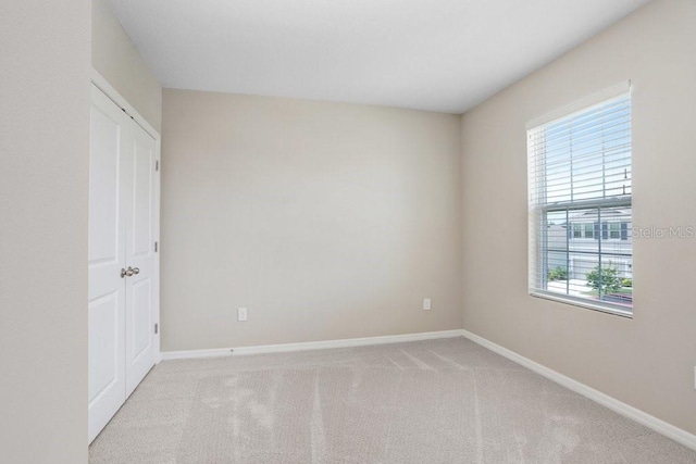 5430 Thistle Field Ct, Wesley Chapel, FL 33545 - unfurnished bedroom with baseboards and carpet flooring