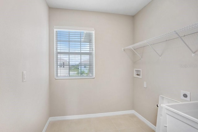 5430 Thistle Field Ct, Wesley Chapel, FL 33545 - washroom with hookup for an electric dryer, washer hookup, and light tile patterned flooring