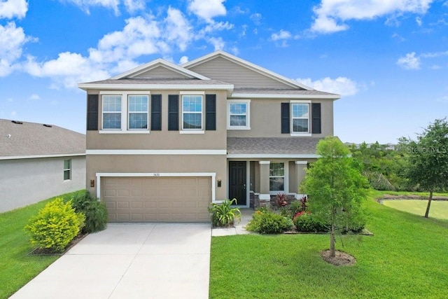 5430 Thistle Field Ct, Wesley Chapel, FL 33545 - view of front facade with stucco siding, a garage, driveway, a front lawn, and a shingled roof