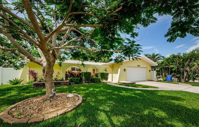14534 Yacht Club Blvd, Seminole, FL 33776 - view of front facade with stucco siding, concrete driveway, a garage, and a front lawn
