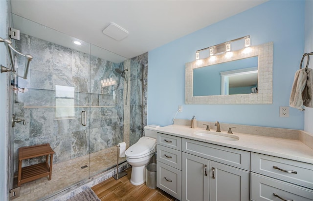14534 Yacht Club Blvd, Seminole, FL 33776 - bathroom with wood finished floors, a stall shower, vanity, and recessed lighting