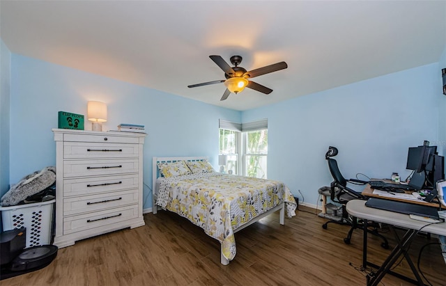 14534 Yacht Club Blvd, Seminole, FL 33776 - bedroom with dark wood-type flooring, a desk, and ceiling fan