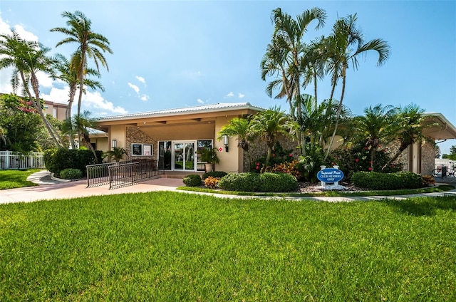 14534 Yacht Club Blvd, Seminole, FL 33776 - back of property with stucco siding and a patio