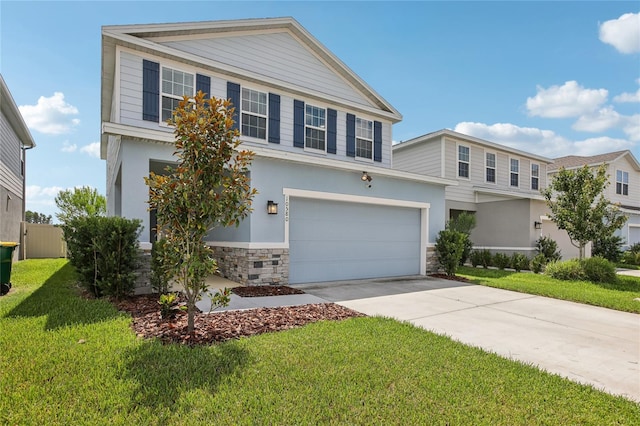 10580 Gliding Eagle Way, Land O Lakes, FL 34638 - traditional-style home with stone siding, concrete driveway, a front yard, and a garage