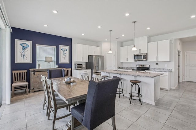 10580 Gliding Eagle Way, Land O Lakes, FL 34638 - dining room featuring light tile patterned floors and recessed lighting