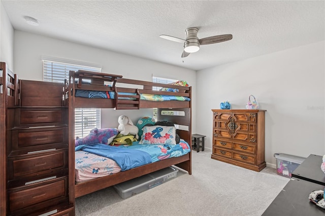 10580 Gliding Eagle Way, Land O Lakes, FL 34638 - bedroom with a textured ceiling, carpet, and ceiling fan