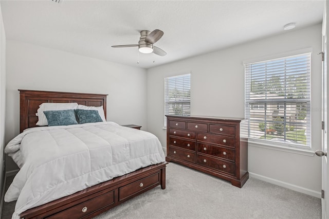 10580 Gliding Eagle Way, Land O Lakes, FL 34638 - bedroom featuring light colored carpet and a ceiling fan